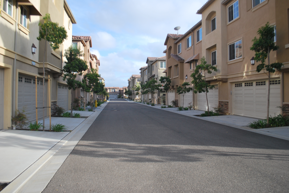 Condo Townhomes with garages and palm trees large